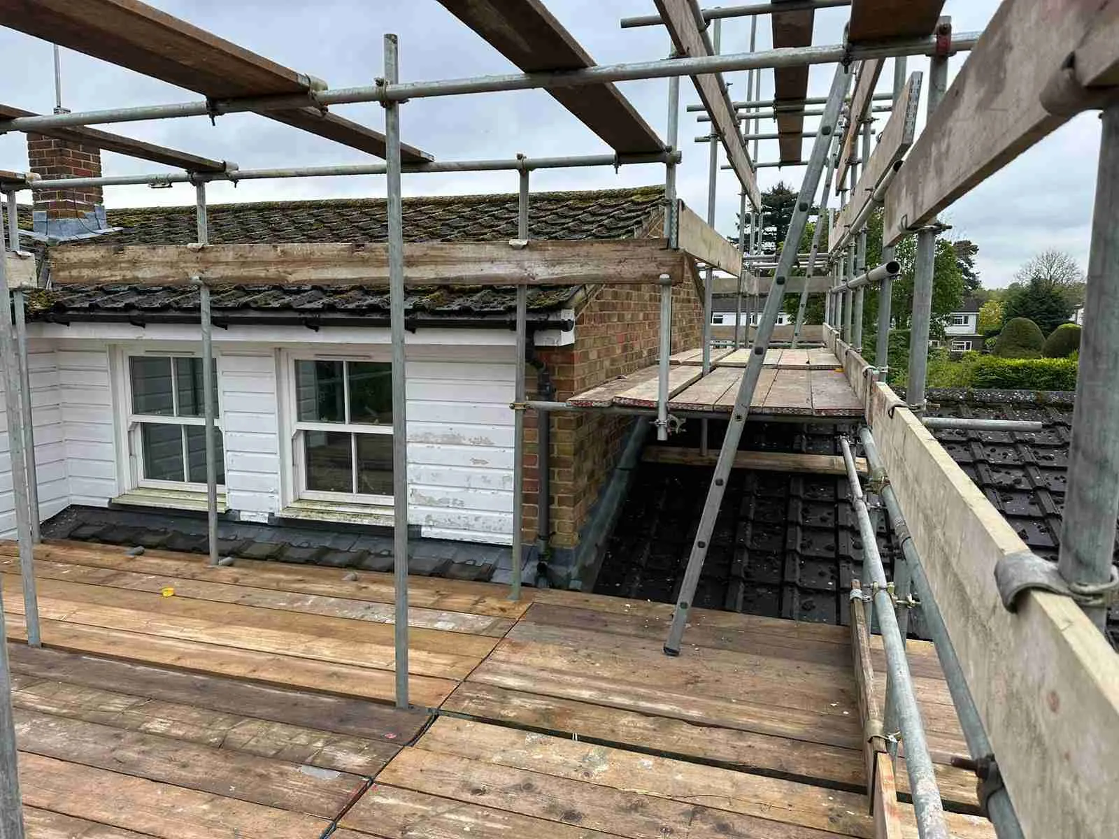 Domestic scaffolding erected by ATC Scaffolding around a house for roofing and exterior works